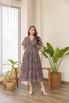Black floral print nursing maxi dress with flutter sleeves.