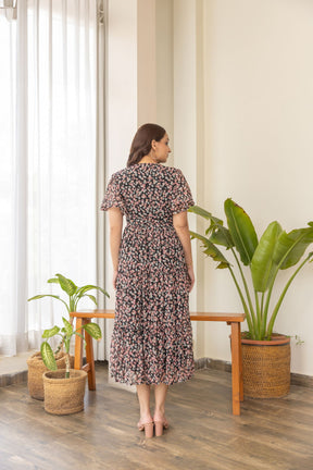 Stylish black floral print nursing maxi dress for effortless elegance.