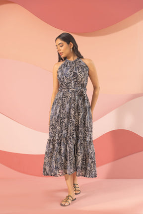 Elegant black halter neck maxi dress with a stylish print.