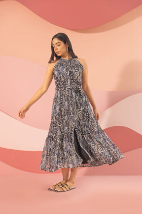 Elegant black halter neck maxi dress with floral design.