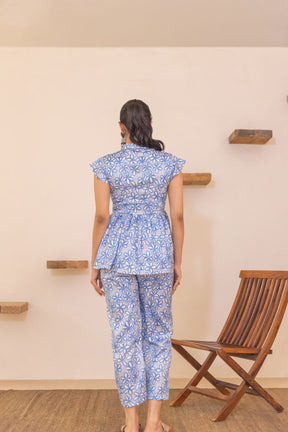 Back view of blue floral satin co-ord outfit for women.