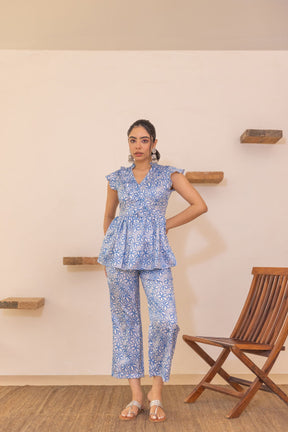 Blue floral satin co-ord set with stylish peplum top and pants.