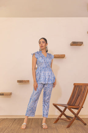Woman wearing blue floral satin co-ord set, stylish and elegant fashion.