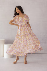 Mosaic print maxi dress in pastel colors, stylish and flowy design.