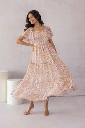 Mosaic print maxi dress in pastel colors, stylish and flowy design.