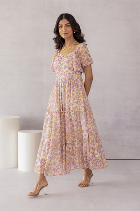 Mosaic print maxi dress featuring floral patterns and tiered design.