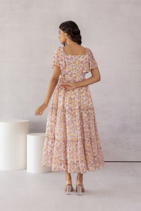 Mosaic Print Maxi Dress featuring a chic floral design and tiered layers.