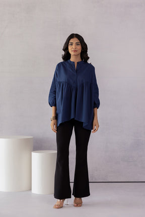 Stylish navy cotton shirt paired with black flared pants.