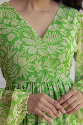 Green and yellow floral maxi dress with elegant V-neck design.