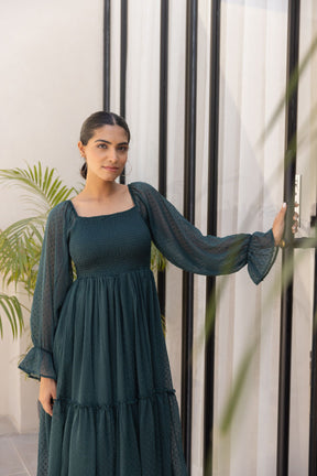 Emerald green chiffon maxi dress with elegant puff sleeves.