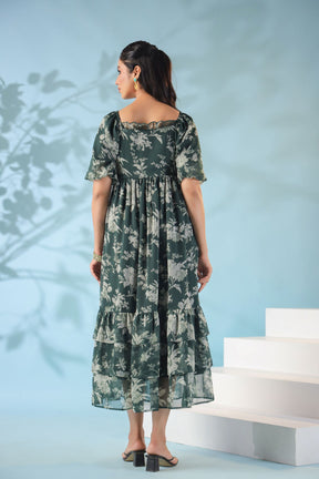 Elegant green nursing maxi dress with floral design.