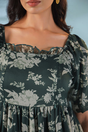 Elegant green nursing maxi dress with floral print and ruffled neckline.