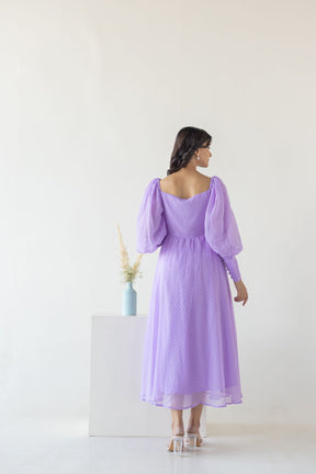 Elegant lilac maxi dress with puff sleeves, perfect for special occasions.