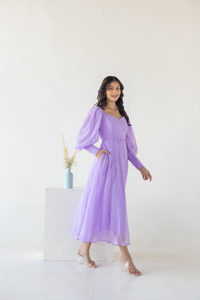 Model wearing the Lilac Princess Maxi dress with puffed sleeves.