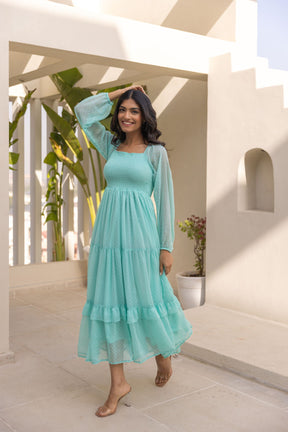 Mint green chiffon maxi dress, featuring tiered design and long sleeves.