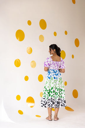 Multicolour smocked maxi dress with floral design and playful polka dots.