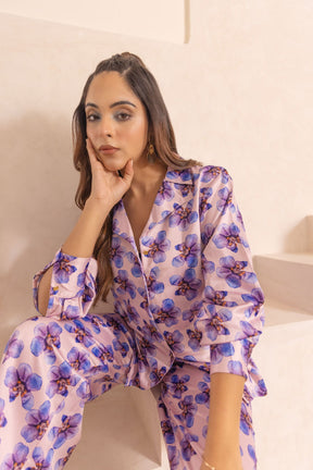 Model showcasing pastel satin co-ord set with floral design.