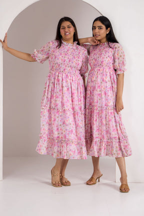 Pink floral smocked maxi dress from Polago Plus, stylish and elegant.