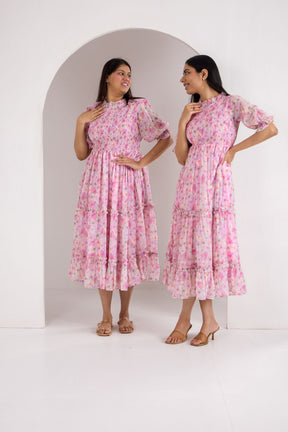 Pastel smocked maxi dress, trendy floral design for stylish women.