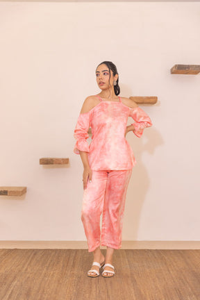 Peach off-shoulder co-ord set with stylish flared sleeves.