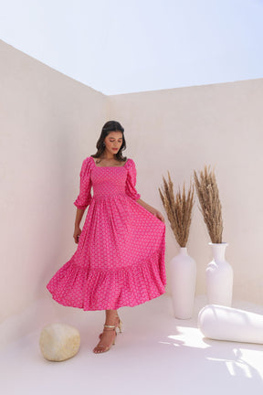 Stylish woman in pink butta cotton maxi dress, bright summer fashion.