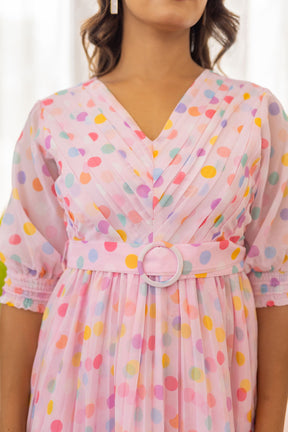 Pink polka pleated maxi dress with stylish belt detail.