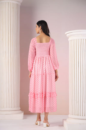 Back view of a pink gingham maxi dress with puff sleeves.