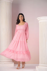 Model wearing a pink gingham maxi dress with puff sleeves.