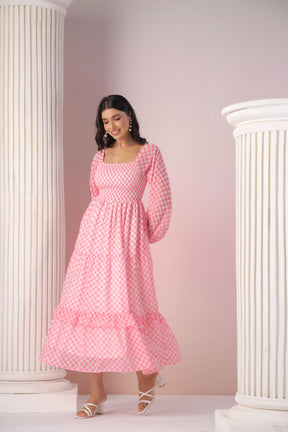 Model wearing PINK GINGHAM MAXI dress with elegant design and style.