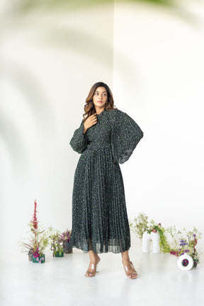 Elegant woman wearing Pleats on Pleats Maxi dress in floral print.