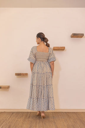 Polka smocked maxi dress with tiered design and stylish back view.