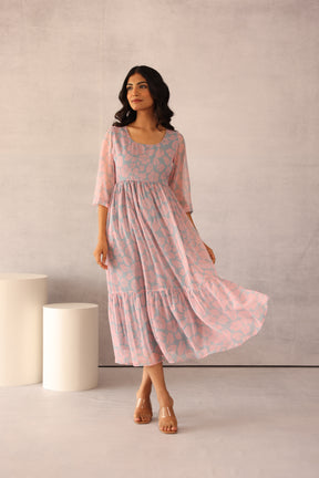 Grey and pink floral maxi dress with flowy silhouette.