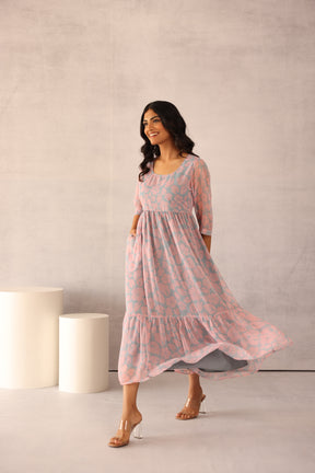 Elegant grey and pink maxi dress with floral design.