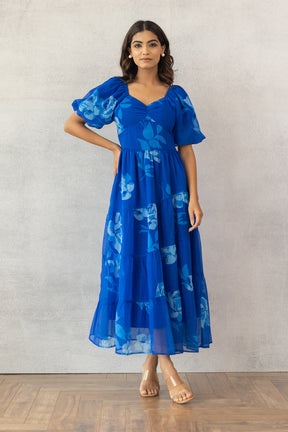 Royal Blue Maxi Dress with Floral Design and Puff Sleeves.