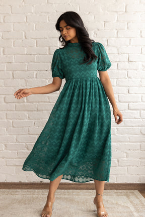 Elegant green maxi dress with puff sleeves, perfect for any occasion.