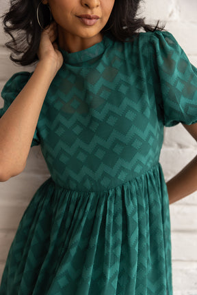 Stylish model wearing the GREEN BUTTA MAXI - POLAGO PLUS dress.