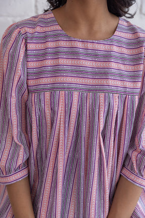 Pink striped cotton top with a relaxed fit and stylish design.