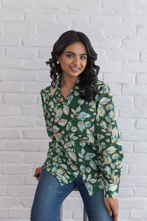 Green cotton shirt top with floral design on model.