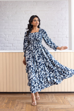 Smocked cotton nursing maxi dress in navy floral pattern.
