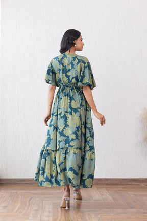 Elegant green floral maxi dress with a flattering silhouette.