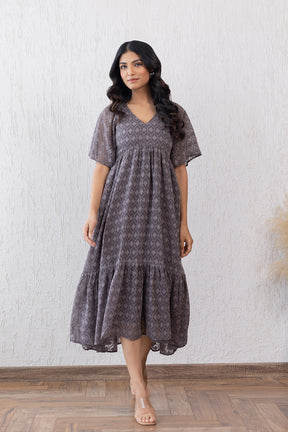 Grey Jacquard Maxi Dress with elegant tiered skirt and flutter sleeves.