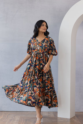 Model wearing colorful floral maxi dress, stylish and feminine design.