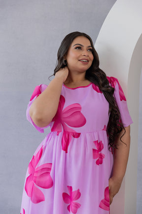 Pink floral maxi dress by Polago Plus, perfect for summer wear.