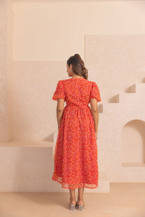 Elegant red chiffon slit maxi dress showcasing floral design.