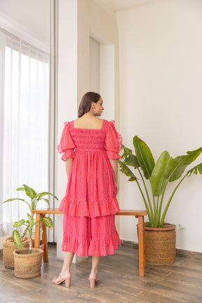 "Ruffle smocked nursing maxi dress in vibrant pink, stylish and comfortable."