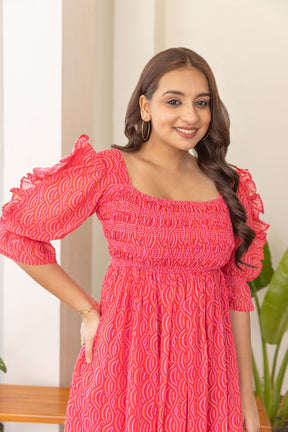 Ruffle smocked nursing maxi dress in vibrant pink design.