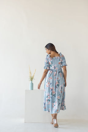 Sky blue floral cotton maxi dress with short puff sleeves.