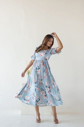Sky blue floral cotton maxi dress model showcasing elegant style.