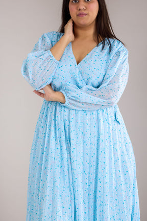 Sky blue pleated maxi dress for stylish plus-size women.