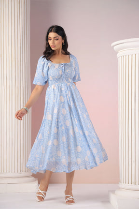 Sky blue and cream maxi dress with elegant floral pattern.